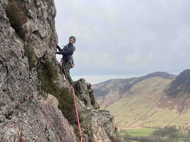 Woman rock climbing in the Lake District